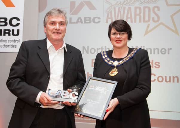 Bill Richards of South Tyneside Council receiving his award from LABC President Jayne Hall.