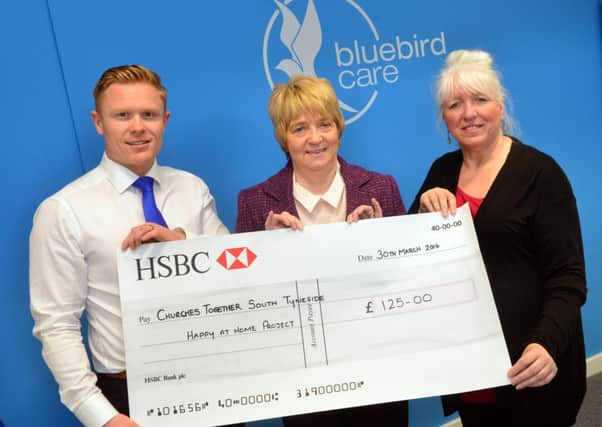 Bluebird Care group grants. from left owner David Haswell, Happy at Home Margaret Stephenson-Gray and care manager Lynn Boll.