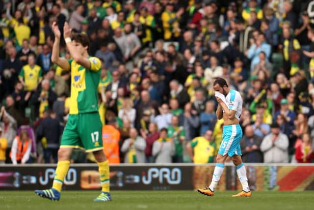 Andros Townsend is left dejected after the final whistle at Norwich
