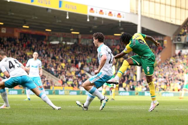 Dieumerci Mbokani scores his side's second goal of the game