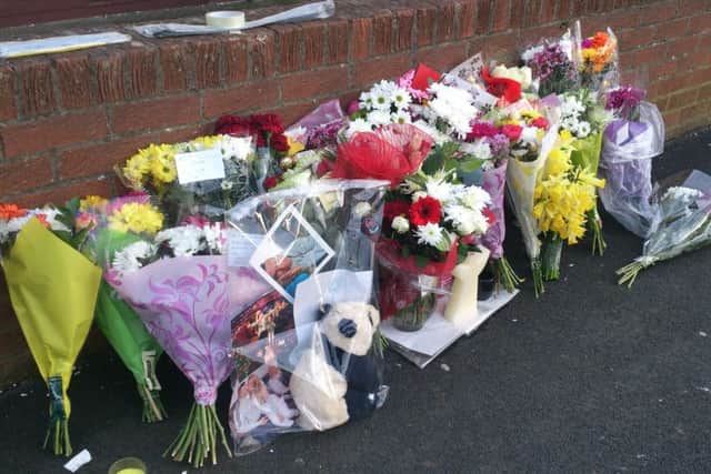 Flowers left following the death of James Wilson