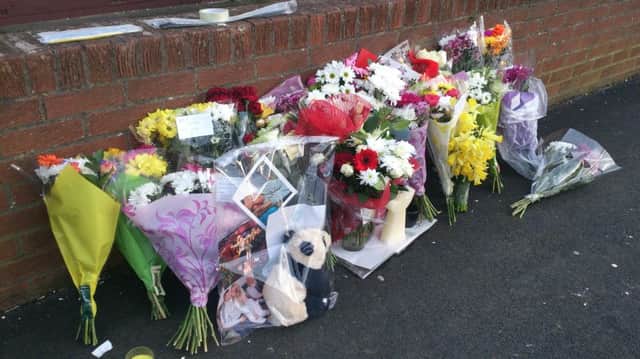 Flowers left following the death of James Wilson