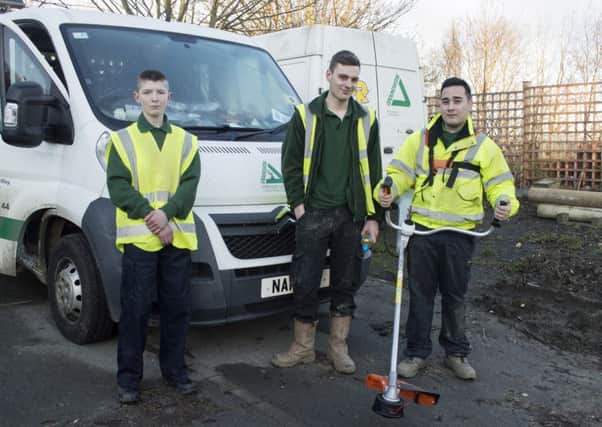 Groundwork trainees Dillon Ross, Callum Jackson and Mark Twigg with their new professional gardening strimmer.