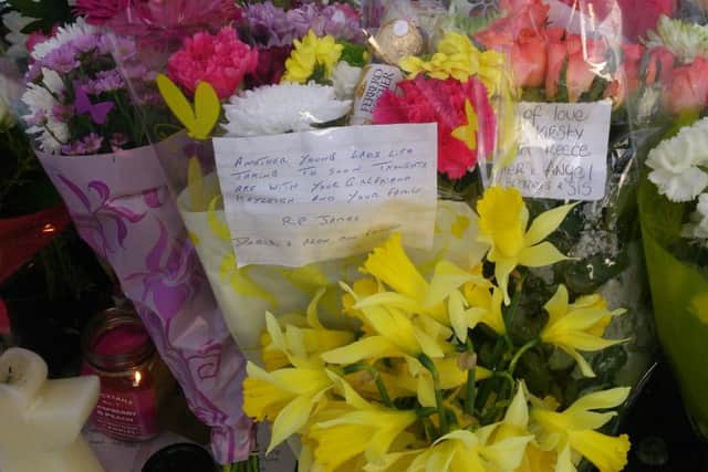 One of the floral tributes left following the death of James Wilson.
