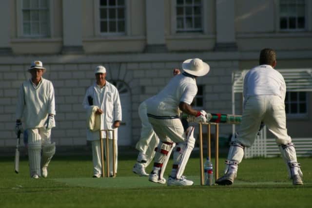 A group of men playing cricket together. PA Photo/thinkstockphotos