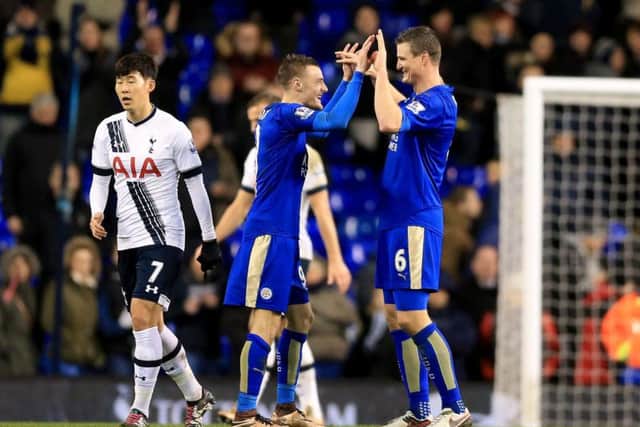 Robert Huth celebrates with Jamie Vardy