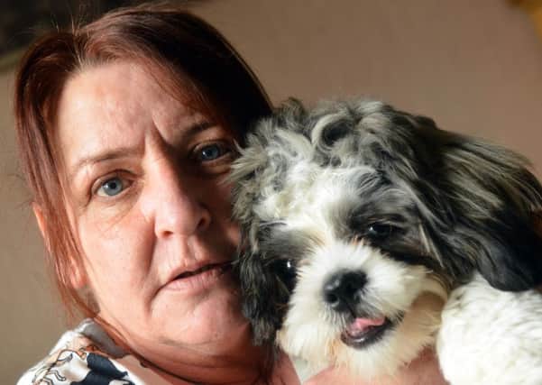 Linda Stubbs , with her beloved dog Dusty, who has been diagnosed with a heart murmur.