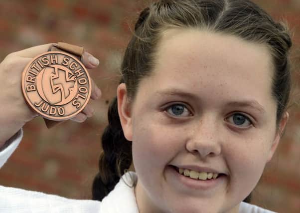 Meghan Roeves with her Judo medal.