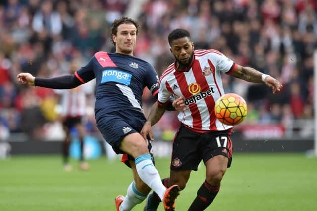 Daryl Janmaat, left