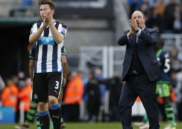 Newcastle United manager Rafael Benitez applauds the fans  alongside player Paul Dummett