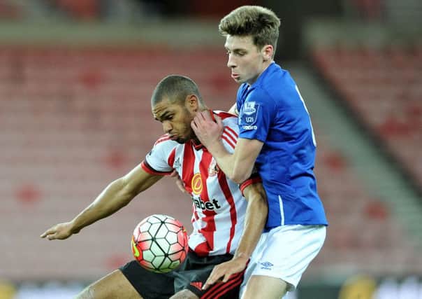 Mikael Mandron keeps possession under pressure against Everton U21s