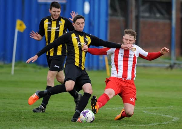 Hebburn Town (black yellow) in action against Ryhope CW.
