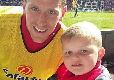 SAFC player Billy Jones gives one of shirts to Jak Michum.