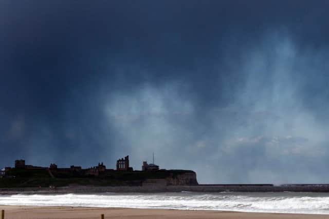 A snow storm moves over Tynemouth Priory and South Shields.