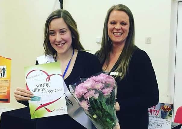 Lauren Driver, left, is presented with her award at the Whiteleas Slimming World group.