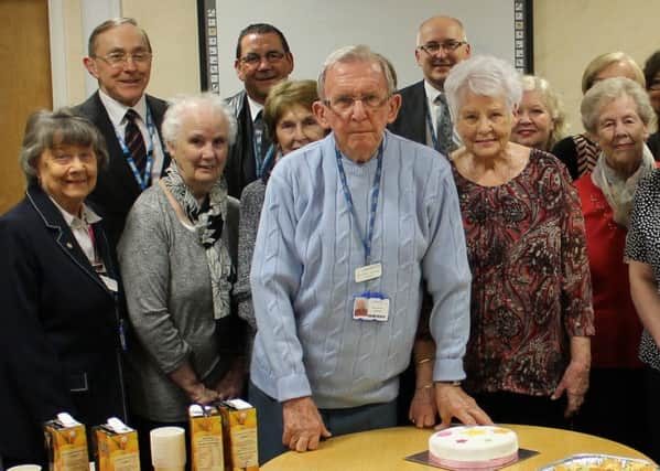 Members of staff and fellow volunteers at South Tyneside District Hospital say farewell to John Johnson, whose wife Betty is by his side.
