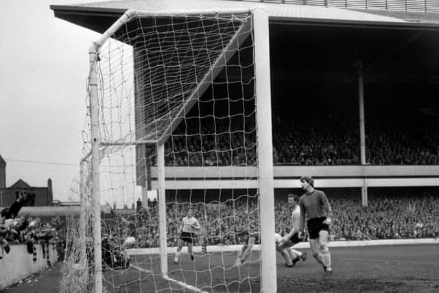 Sunderland goalkeeper Jim Montgomery (right) looks on helplessly as West Ham's first goal is headed in by Geoff Hurst (third from right). PRESS ASSOCIATION Photo.