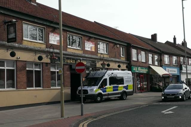 A police van stands outside the Prince Edward pub at The Nook in the aftermath of Ronnie Howard's death.