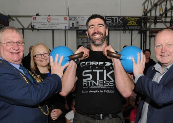 Ant Clennan is supported by the Mayor Coun Richard Porthouse, Mayoress Patricia Porthouse and Jarrow MP Stephen Hepburn, at his kettlebell world record.