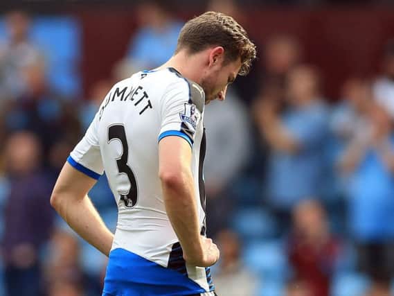 Defender Paul Dummett shows his dejection at the end of the 0-0 draw with Aston Villa which effectively ended Newcastle's survival hopes.