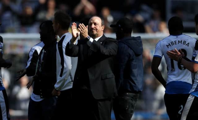 Rafa Benitez applauds the fans at the final whistle