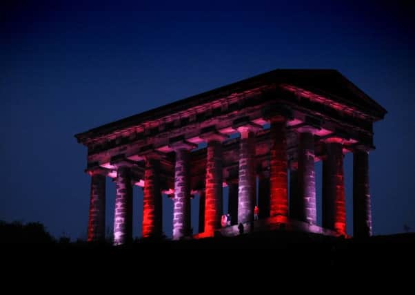 Penshaw Monument is lit up red and white to celebrate Sunderland Football club's success.