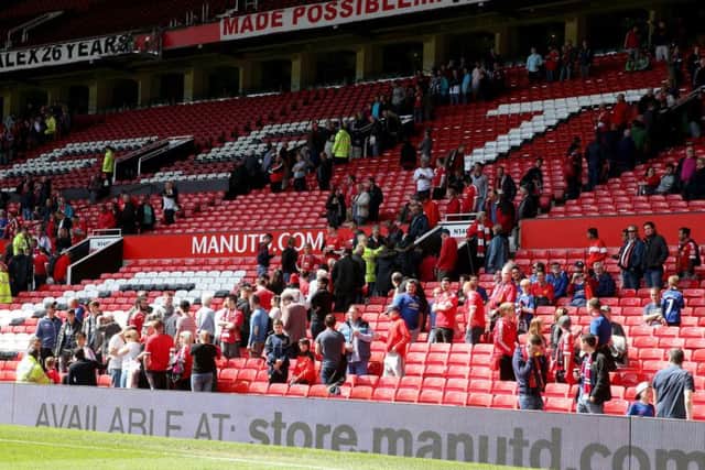 Old Trafford was evacuated before the game was abandoned.