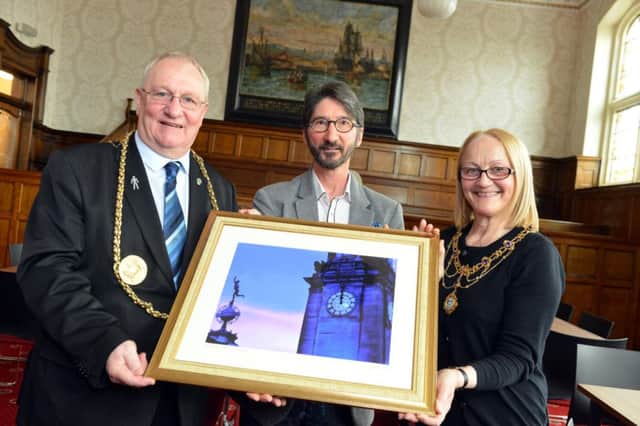 Mayor and mayoress Richard and Patricia Porthouse receive a gift from John Pattison