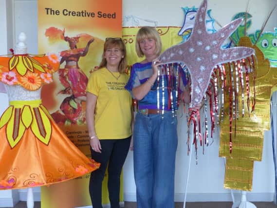 From left to right, Sandy Harris, of The Creative Seed, with Alison Maynard, principal of South Tyneside Colleges Professional and Vocational College, with parade props.