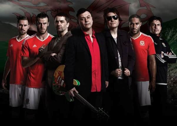 Manic Street Preachers, centre, with the Welsh national football team and boss Chris Coleman to promote their latest single, Together Stronger (C'Mon Wales).