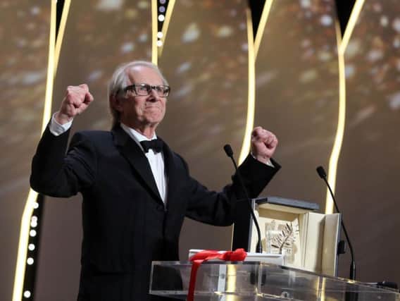 Ken Loach collects the award at the Cannes Film Festival.