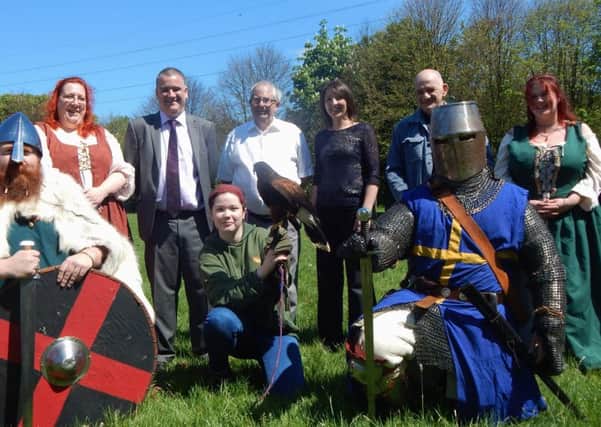 L-R: Coun Ken Stephenson, vice chair of Jarrow Festival Committee, Roy Merrin, chairman of Jarrow Festival Committee, Sarah French, Groundwork's Business Director, Riverside Falconry, Sean North - Time and Tide Events, with members of the Moss Troupers and Making History group.