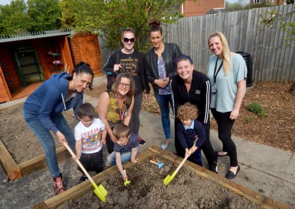 Children, parents and staff at the revamped allotment at Bede Childrens Centre in Jarrow.