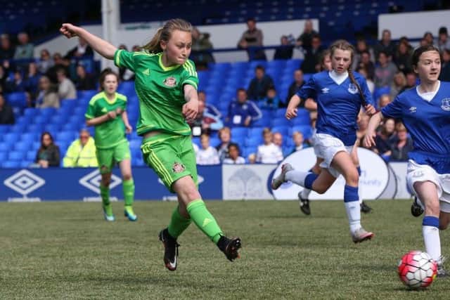Lucy Whittle goes for goal