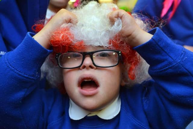 Charlie Adamson, 4, enjoys Wig Wednesday at Bamburgh School.