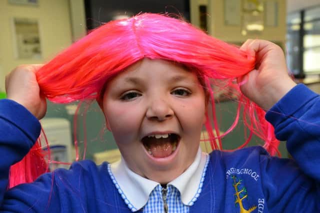 Sila Turk, 9, enjoys Wig Wednesday at Bamburgh School.