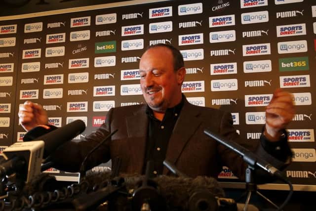 Rafa Benitez is all smiles at his press conference