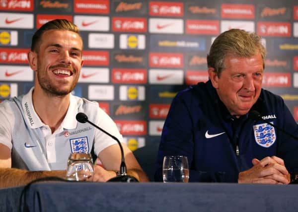 Jordan Henderson enjoys a joke with England coach Roy Hodgson at a press conference ahead of tonight's England-Australia friendly at the Stadium of Light