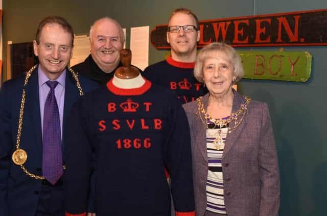 Tom Fennelly, Honorary Secretary of South Shields Volunteer Life Brigade, and Captain Gary Hannah showing the Mayor and Mayoress of South Tyneside the brigades knitted gansey