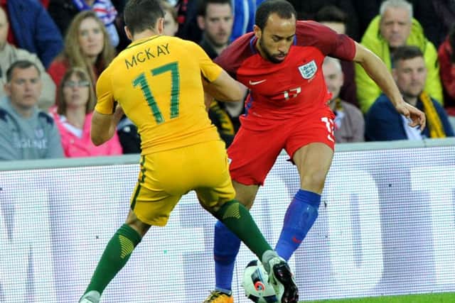 England sub Andros Townsend takes on Australia's Matt McKay. Picture by Frank Reid