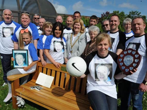 Karen Rutter with those who organised a charity football tournament in memory of her son Aaron Todd.