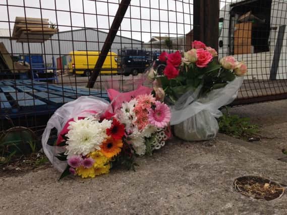 Flowers left in Amos Ayre Place in tribute to Ava Henderson