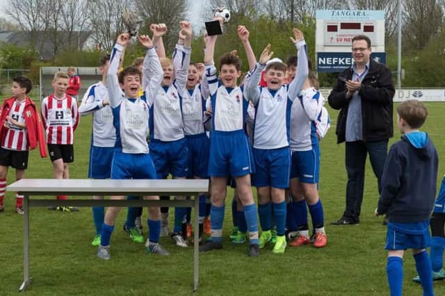 Jarrow Youth Under-13s celebrate winning their tournament.