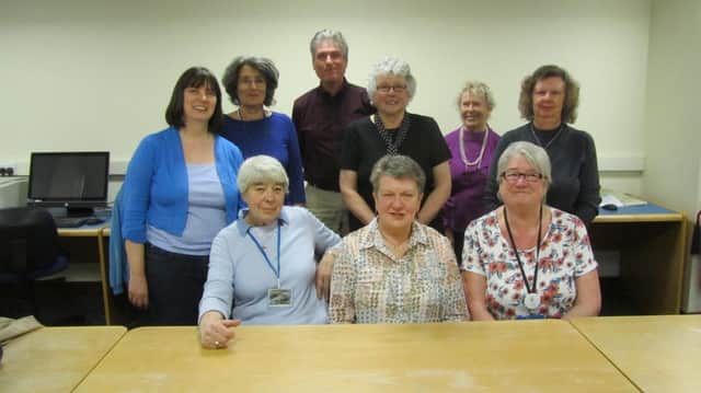 The South Shields library volunteers and staff who are digitalising the photographic archive.