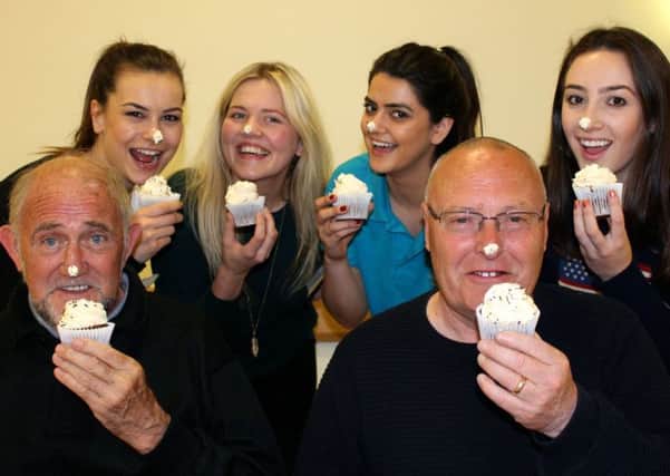 Alzheimer's Society staff promote its national Cupcake Day, being held on Thursday, June 16.
