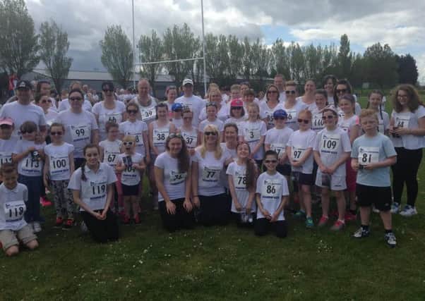 Helen Mackerill (front row wearing number 77) and Team Mac take part in the Rainbow Dash Run for St Clare's Hospice