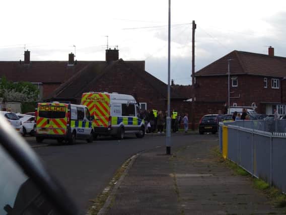 Police attend the scene after reports of a Staffordshire Bull Terrier attacking people on an estate in Blyth. Picture by John Tuttiett.