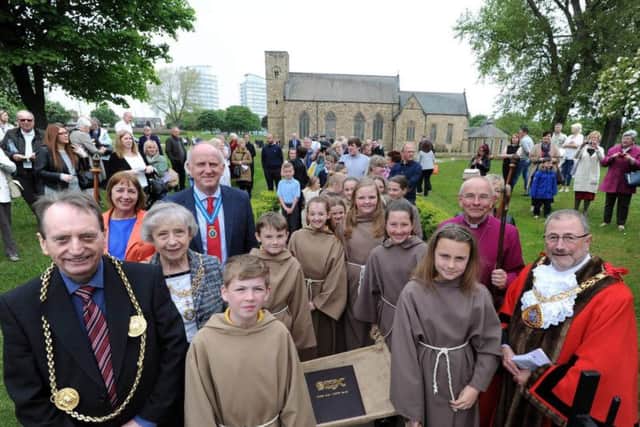 Pupils with the Children's Codex are joined by members of the congregation including Mayor of South Tyneside Coun Alan Smith (left), HighSheriff of Tyne and WearJohn Mowbray OBE (fourth left), Bishop of Jarrow, the Right
Reverend Mark Bryant (second right) and Mayor of Sunderland  CounAlanEmerson.
