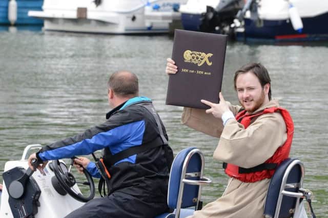 Bede Porter sets off with the Codex on the first stage of its journey - to the other side of the River Wear.