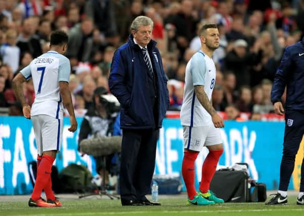 England manager Roy Hodgson looks on as Jack Wilshere makes a substitute appreance in a friendly warm up.